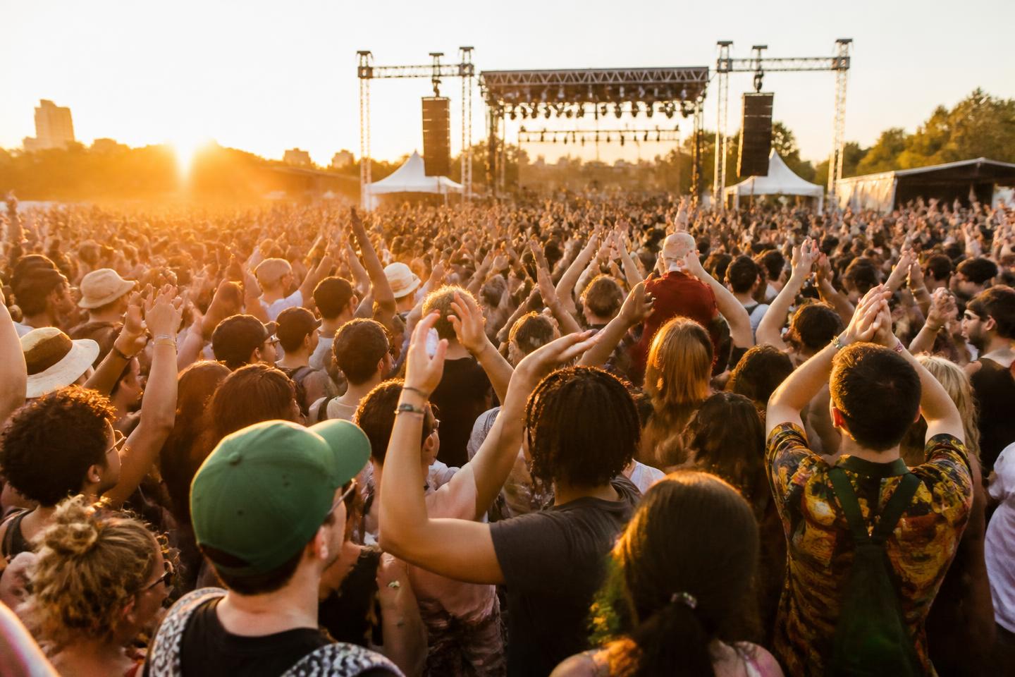 Large festival audience in front of an outdoor stage